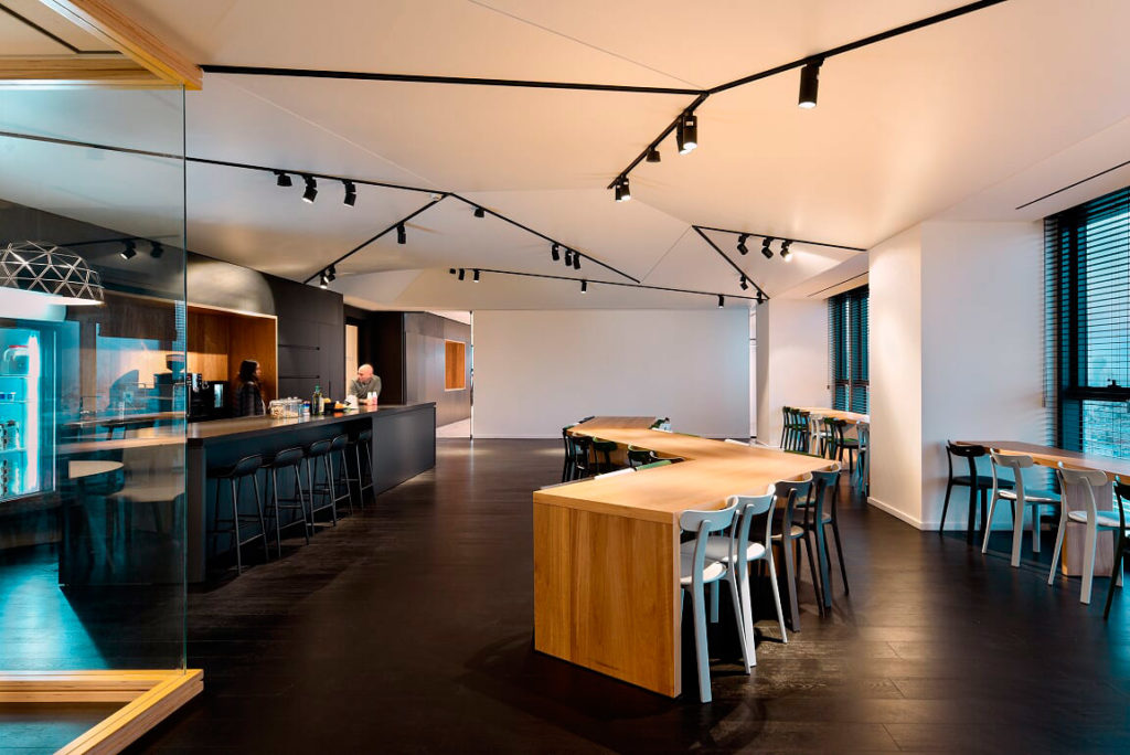 Triangular ceilings in office — Saros Design